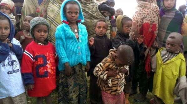 Our family's knit coat and tiger print jacket found new homes in the Ambaras village in the Simian Mountains of Ethiopia in 2013.