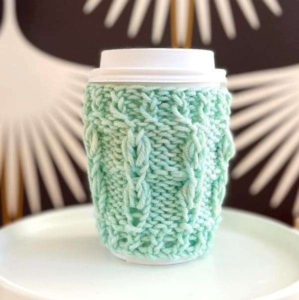 Knit Feather Stitch Cup Cozy. Free pattern from Vickie Howell